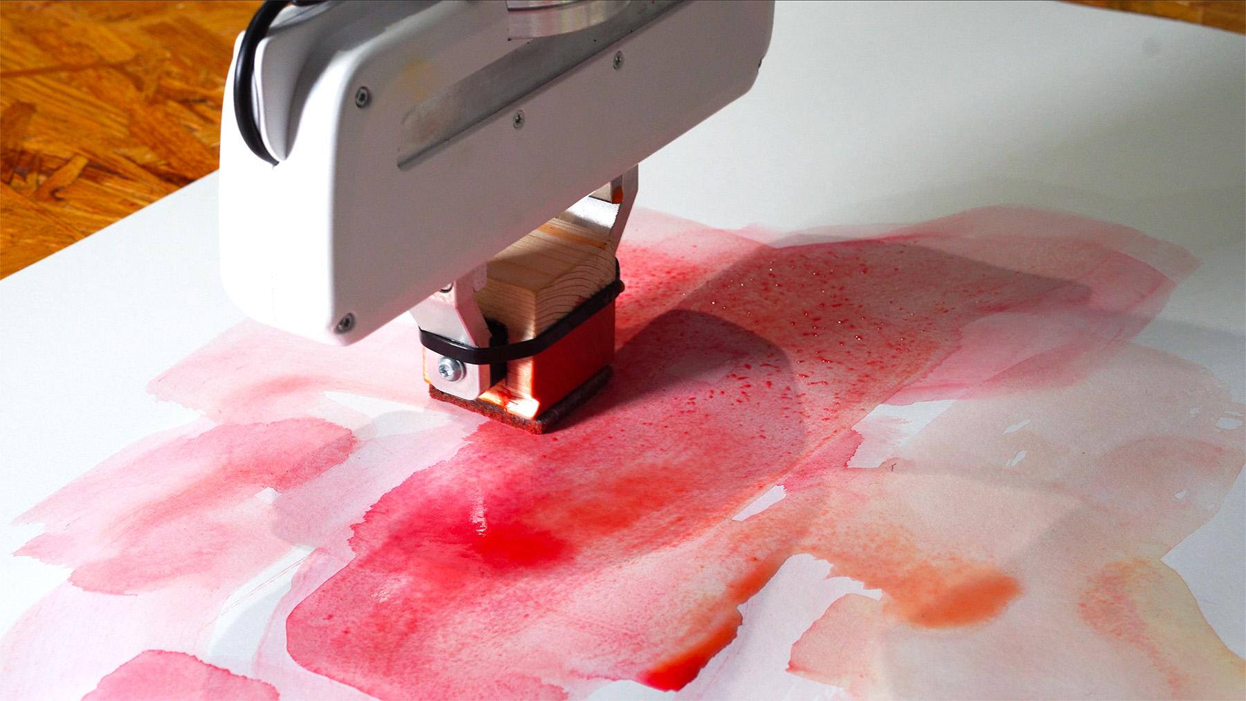 Participant leading the robotic brush with hand gestures