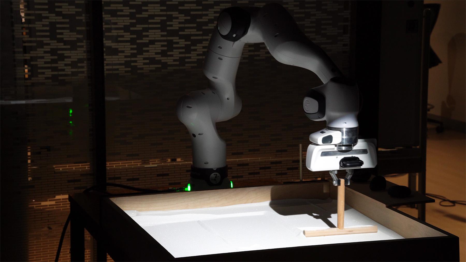 Franka arm smoothing sand during the Contemplation piece